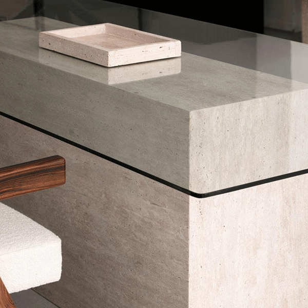 Furniture combining stone and glass surfaces
